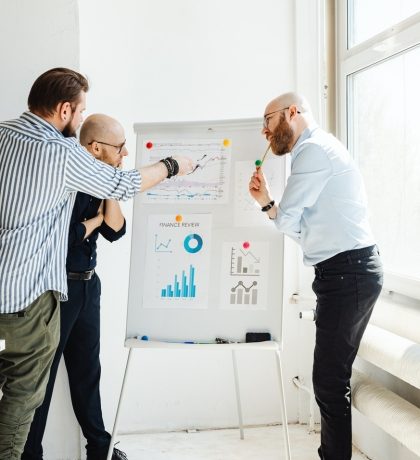 startup team reviewing product interface on screen