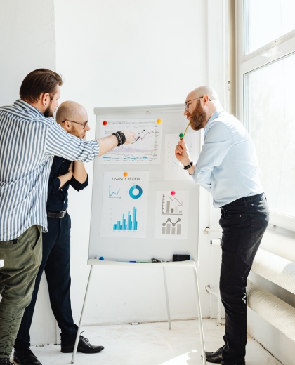 startup team reviewing product interface on screen