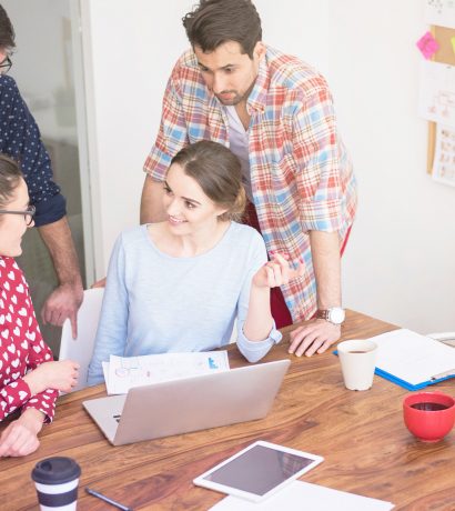 founders collaborating with wireframes and laptops