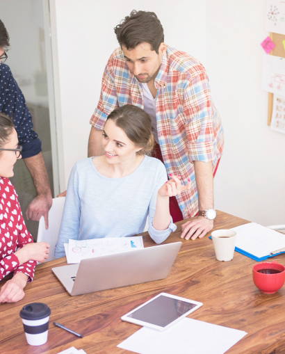 founders collaborating with wireframes and laptops